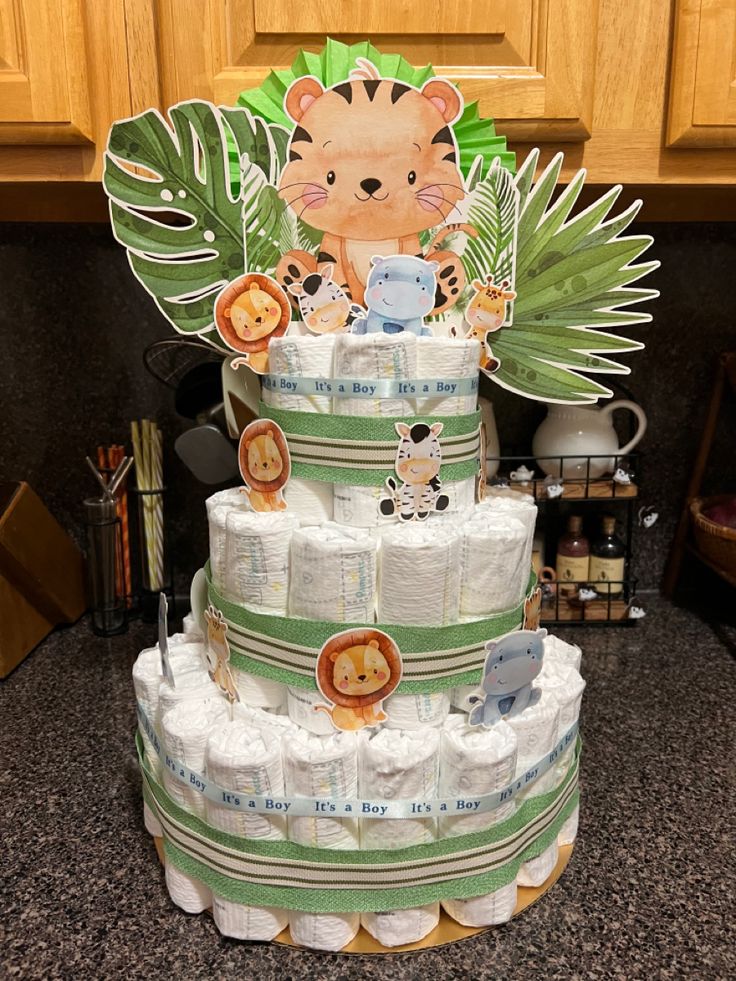 a diaper cake made to look like a jungle animal with lots of diapers on it