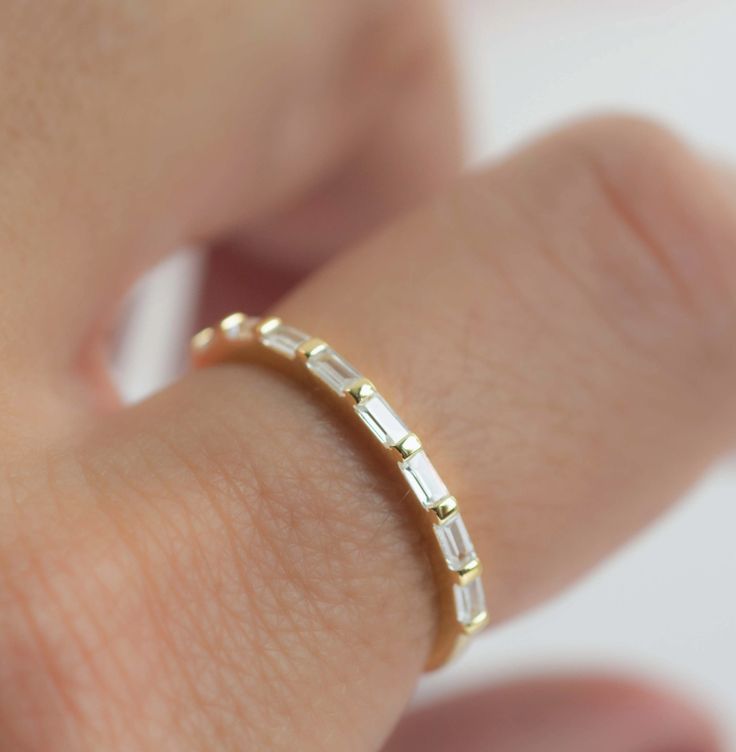 Sweet, simple, and dainty ring. Perfect for a minimalist look, or for stacking! Materials: 14K Gold Plate on Sterling Silver + CZs 14k Gold Stackable Rings For Everyday, Dainty Everyday Stackable Rings With Prong Setting, Minimalist Round Rings With Baguette Diamonds, Everyday Stackable Baguette Cut Jewelry, Minimalist Everyday Stackable Rings With Baguette Cut, Everyday Stackable Rings With Baguette Cut, Dainty Stackable Diamond Ring, Everyday Minimalist Stackable Rings With Baguette Cut, Dainty White Diamond Ring