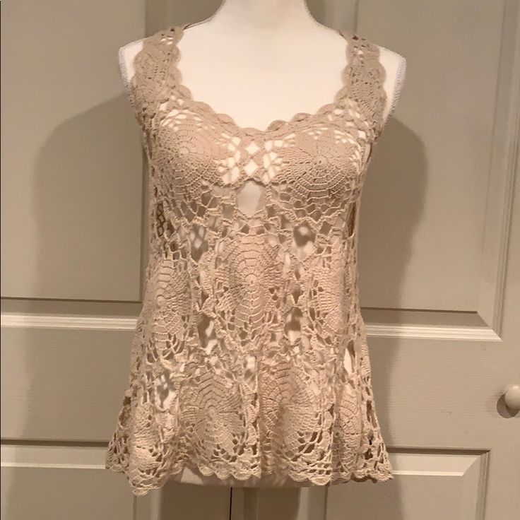 Brand New W/O Tags. Cream Colored Crochet Tank. Armpit To Armpit Is 14” Laying Flat And From Shoulder To Hem In Front Is 25” With The Back Being 27”. Fitted Crochet Lace Knit Top For Summer, Beige Stretch Crochet Top For Spring, Beige Stretch Top With Crochet Lace, Bohemian Knit Top With Crochet Trim, Fitted Crochet Lace Tank Top For Spring, Beige Crochet Lace Knit Top For Spring, Fitted Knit Lace Top For Spring, Fitted Open Knit Lace Top For Summer, Fitted Lace Knit Top For Spring