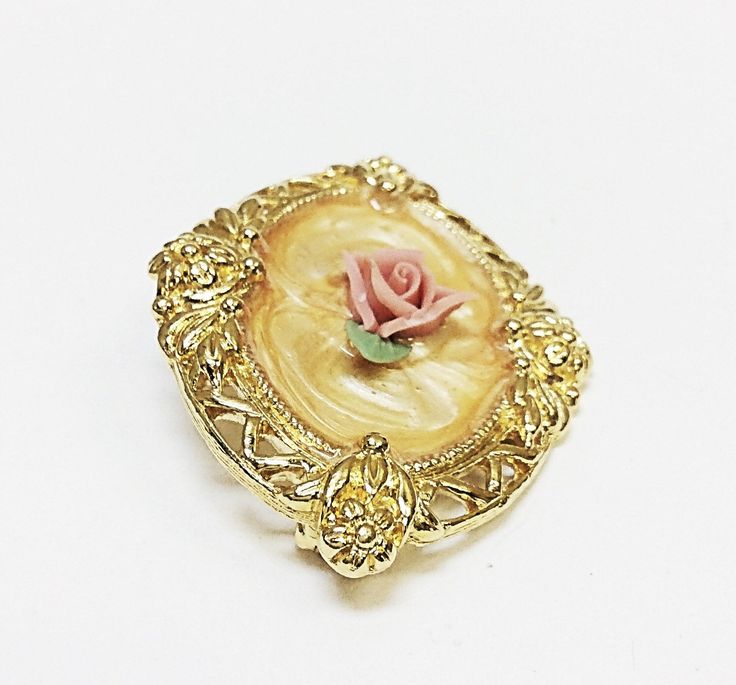 "Up for your consideration is a beautiful gold toned floral enamel brooch! Approx total length 1.875\" inch. Approx total weight 13.29 grams." Gold Formal Enamel Pin, Gold Flower Lapel Pin For Formal Occasions, Formal Gold Enamel Brooches, Gold Enamel Lapel Pin, Gold Enamel Brooch Pin, Elegant Gold Enamel Pin Collectible, Formal Flower-shaped Enamel Brooches, Formal Flower Enamel Brooches, Elegant Gold Enamel Pin For Collectors