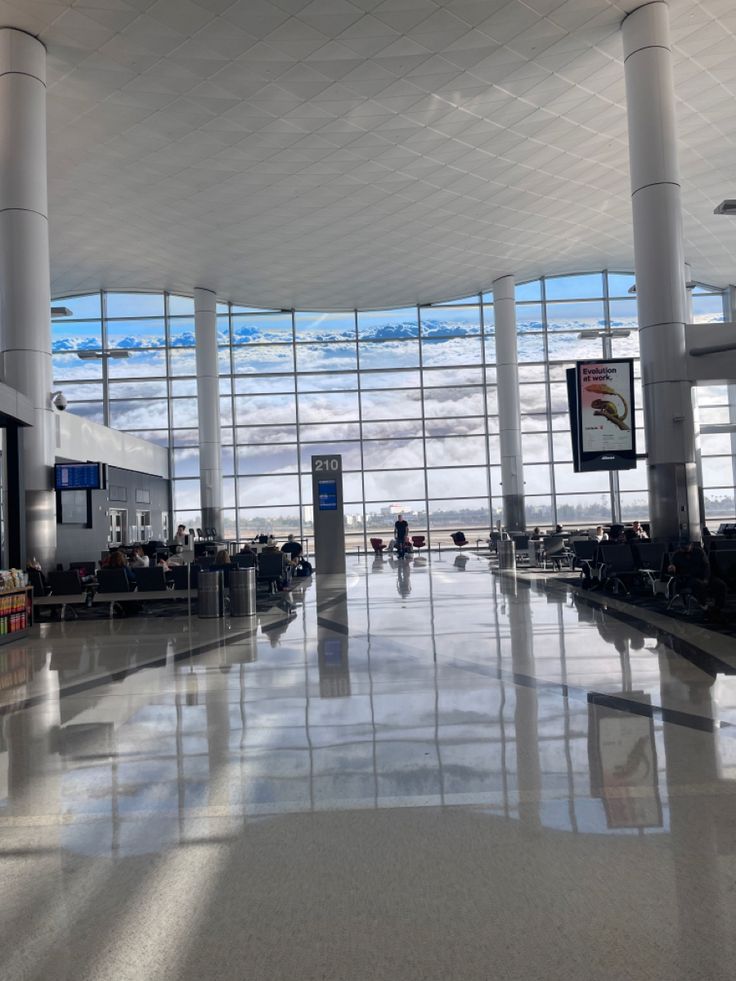 the inside of an airport terminal with large windows