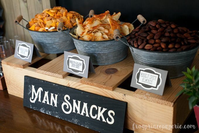 a table topped with buckets filled with lots of food