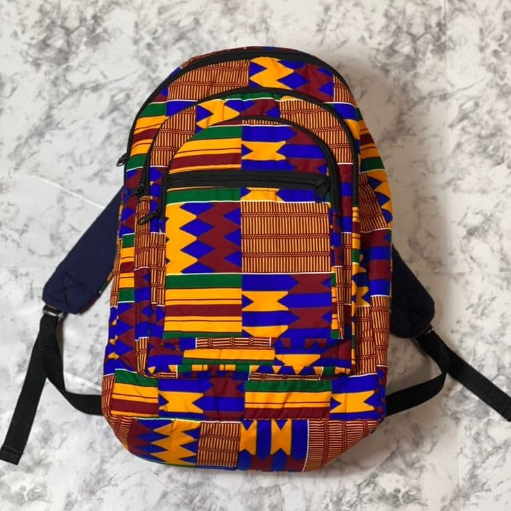 With bold colors and patterns these book bags will be the talk of the town. -Each bag has four pockets to hold all supplies needed for the day. -Adjustable straps-17 inches tall Need something a little smaller, check out our Small Ankara Book Bags. Multicolor Everyday Backpack With Adjustable Straps, Multicolor Backpack With Adjustable Straps For Everyday Use, Multicolor Rectangular Backpack For Trip, Multicolor Laptop Bag For Trips, Yellow Shoulder Bag For Back To School Travel, Multicolor Rectangular Backpack With Zipper Pocket, Multicolor Everyday Bag With Multiple Pockets, Multicolor Everyday Bags With Multiple Pockets, Multicolor Student Backpack With Adjustable Strap