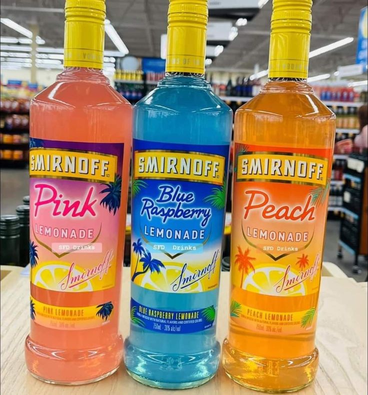 three bottles of pink lemonade and blue raspberry lemonade