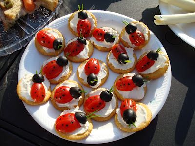 a plate full of crackers with ladybugs on them