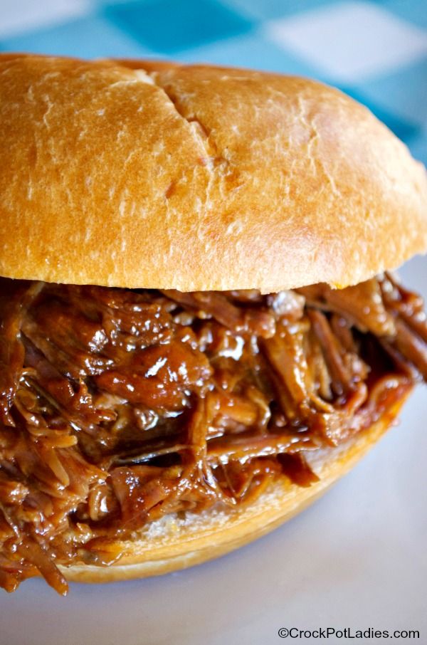 a pulled pork sandwich with barbecue sauce on it