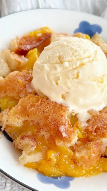 a close up of a plate of food with fruit and ice cream on the top