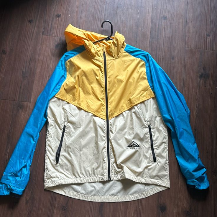 Brand New Large Nike Windbreaker Blue Nike Nylon Outerwear, Nike Blue Nylon Outerwear, Blue Nylon Nike Outerwear, Blue Nike Windbreaker For Outdoor, Nike Blue Windbreaker For Outdoor, Spring Sports Yellow Outerwear, Spring Yellow Sports Outerwear, Yellow Spring Sports Outerwear, Winter Yellow Color Block Outerwear