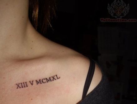 a woman's shoulder with the word xiii v mcmxl tattooed on it