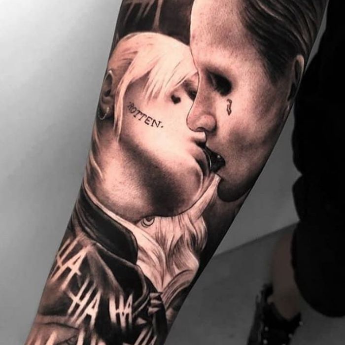 a man's arm with a portrait of two people on it and the words, we are all alright