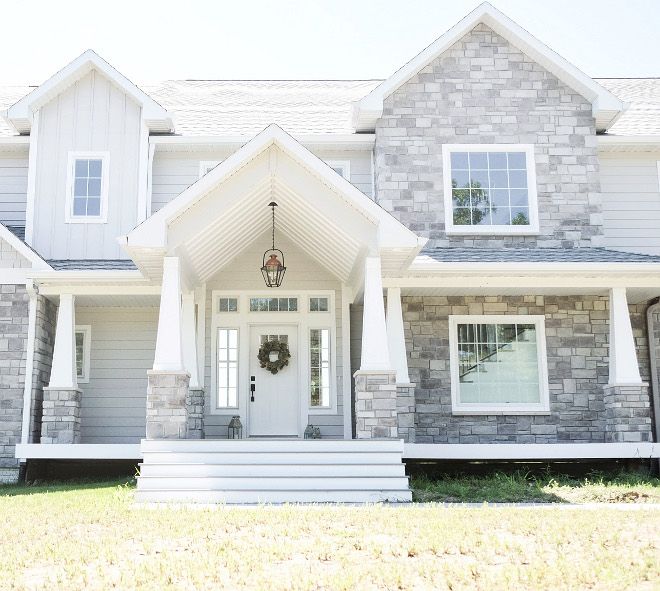 a white and gray house with front porch