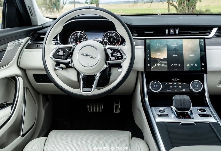 the interior of a car with dashboard, steering wheel and infotains on display