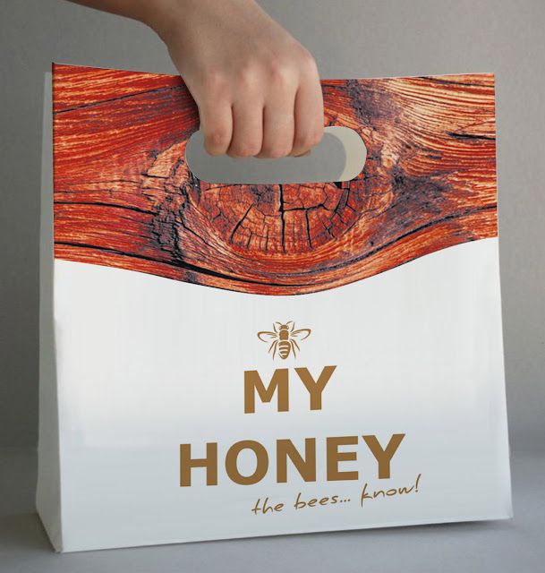 a person holding a bag that says, my honey the best kind