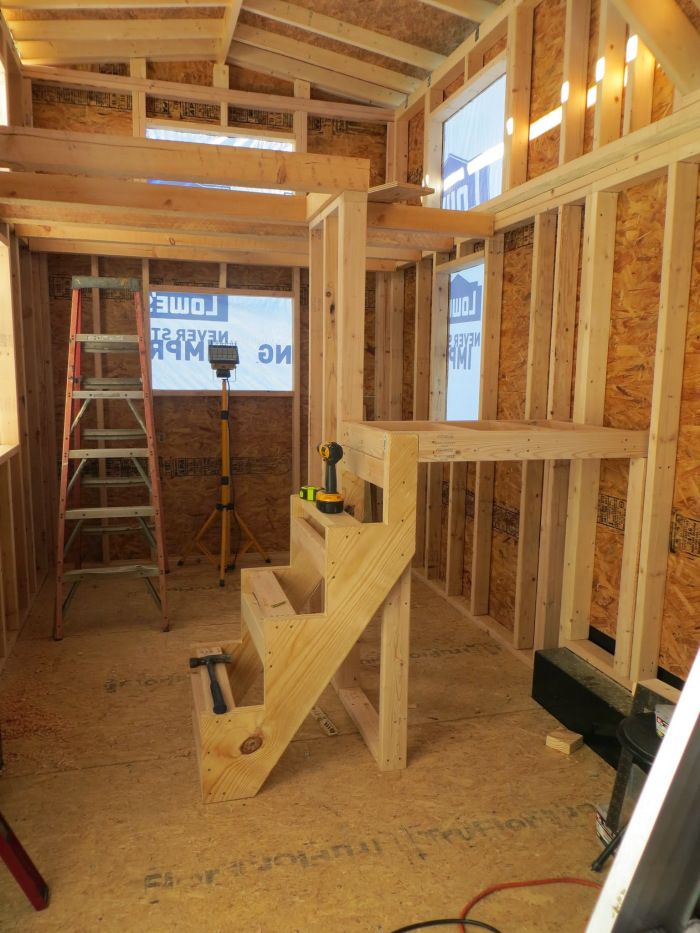 the inside of a house being built with wood framing