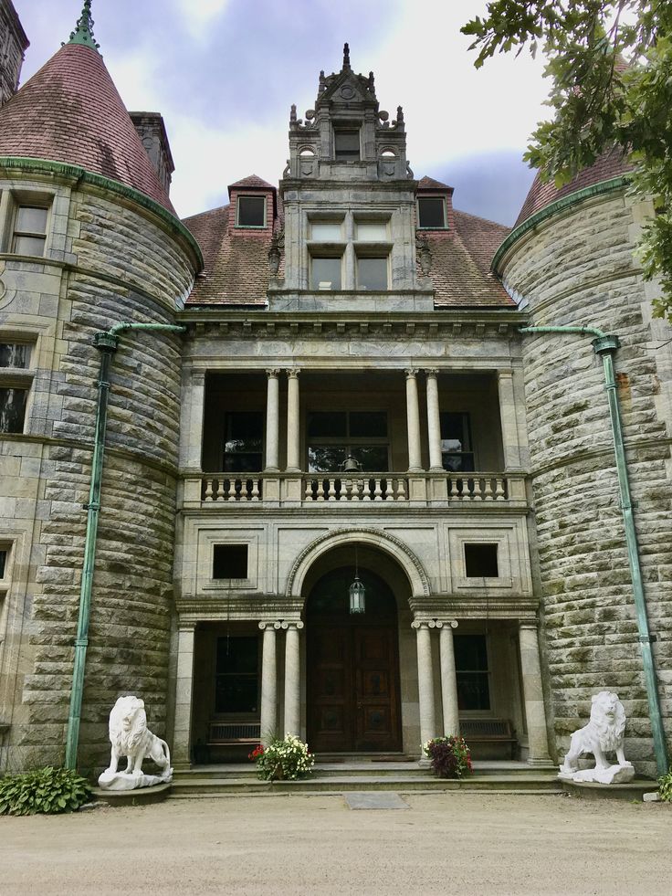 an old building with statues in front of it