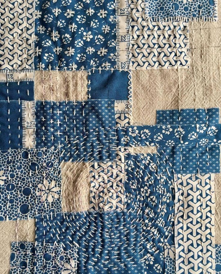 a blue and white patchwork quilt is shown