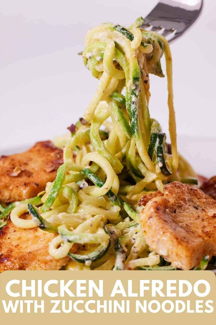 chicken alfredo with zucchini noodles on a white plate