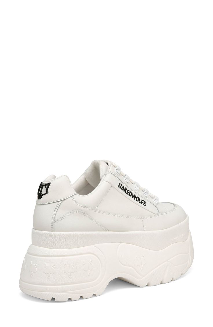 A '90s-inspired sneaker highlighted with signature Naked Wolfe branding and a mega-platform sole brings bold, bodacious style to your shoe rotation. Exclusive retailer 3 1/2" platform Leather upper/textile and leather lining/synthetic sole Imported Leather Chunky Sneakers With White Sole, Leather Chunky Sneakers With White Sole And Logo, White High-top Chunky Sneakers With Logo, Leather Chunky Sneakers With Logo, White Chunky Sneakers For Streetwear With Logo Print, White Chunky Sneakers For Streetwear, Urban White Platform Sneakers, Platform Sneakers With Logo Print For Sports, Logo Print Platform Sneakers For Sports With Round Toe