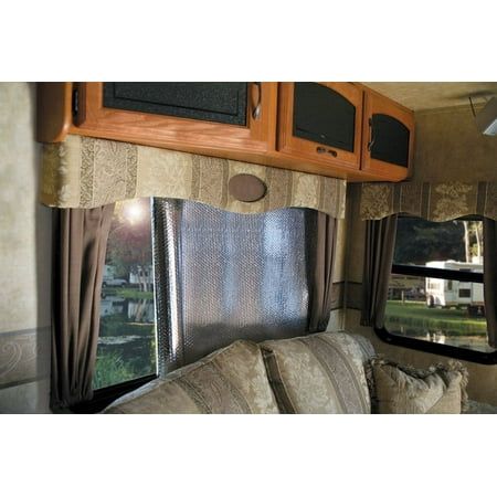 the interior of an rv with couches, cabinets and televisions on it's wall