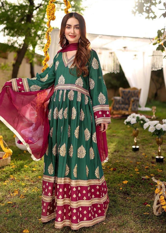 Description Shirt : Dark green and magenta long frock with front cut. Elegant all over Golden thread embroidery. Trouser : Magenta trouser Dupatta : Magenta plain dupatta.. Green Anarkali Kurta With Pallu, Eid Anarkali Floor-length Lawn Suit, Designer Green Anarkali Set For Eid, Traditional Pista Green Maxi Length Kurta, Traditional Pista Green Maxi Kurta, Green Chanderi Maxi Lehenga, Green Chanderi Lehenga Maxi Length, Green Long Sleeve Chanderi Churidar, Green Long Sleeve Anarkali Set