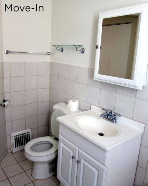 a white toilet sitting next to a sink in a bathroom