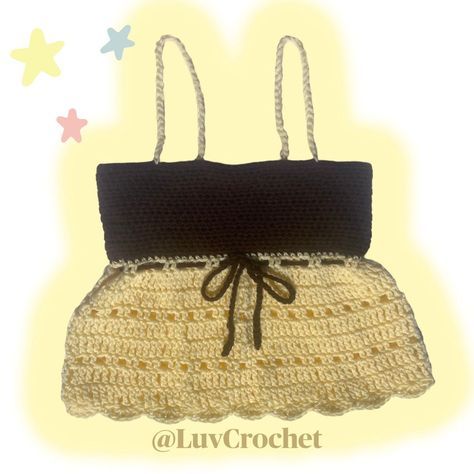 a crocheted purse with a black top and brown bottom is shown on a yellow background