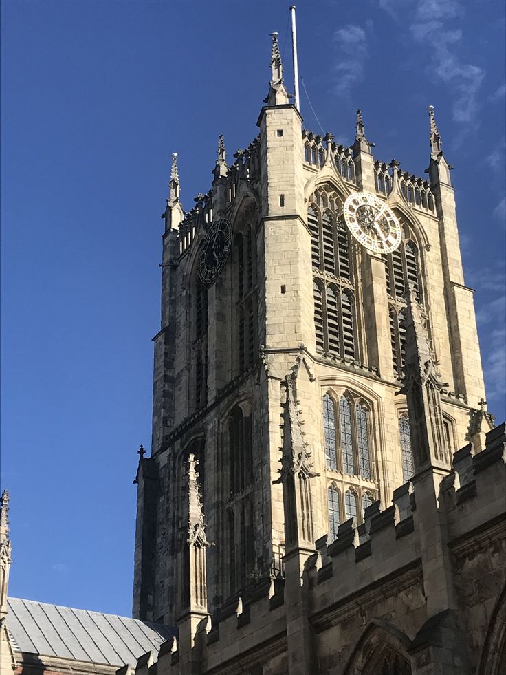 a large cathedral with a clock on the front