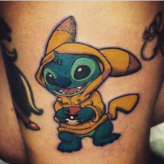 a cartoon character tattoo on the thigh