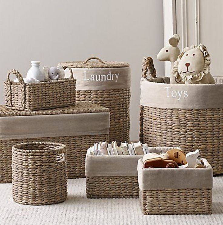 four wicker baskets with stuffed animals in them