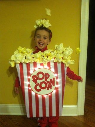 a child in a popcorn box costume