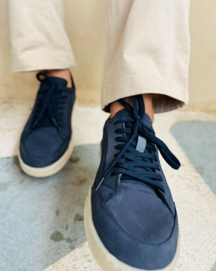 These Men's Navy Blue Sneakers offer a sleek blend of style and versatility. The premium leather upper in a rich navy hue pairs perfectly with the contrasting white sole for a modern, clean look. Designed for comfortable everyday wear, these versatile casual footwear options are perfect for everything from weekend outings to casual Fridays at the office. Experience the ideal balance of fashion and function with these essential sneakers. Sporty Navy Sneakers With Stitched Sole, Navy Casual Custom Sneakers With Rubber Sole, Modern Navy Sneakers With Round Toe, Navy Leather Sneakers With Gum Sole, Navy Low-top Sneakers With Textured Sole, Navy Textured Sole Slip-on Sneakers, Navy Slip-on Sneakers With Textured Sole, Casual Navy Low-top Custom Sneakers, Modern Blue Sneakers With Stitched Sole