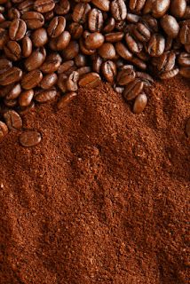 coffee beans and ground coffee on top of each other