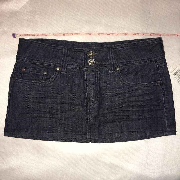 Dark Wash. Size 9. Zipper Fly. Front And Back Pockets. New W/Tags. Waist/Hip 32" Length 11" Fitted Dark Wash Bottoms In Mini Length, Fitted Dark Wash Mini Bottoms, Fitted Mini Denim Skirt With Button Zip Fly, Fitted Mid-rise Mini Skirt With Pockets, Fitted Dark Wash Mini Length Bottoms, Fitted High Rise Dark Wash Mini Skirt, Mid-rise Fitted Skort With Pockets, Fitted Dark Wash Mini Skirt, Fitted Dark Wash Short Skirt