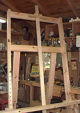 there are many shelves in the room that have tools on them, and one shelf is made out of wood