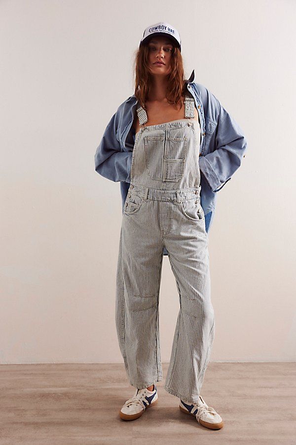 Our top-rated Good Luck Overalls — now in a timeless striped pattern! Featuring the signature barrel-leg fit, you’ll reach for this pair all season long. **Fit:** Bib-and-brace design with wide barrel-leg **Features:** Front bib pocket, tapered knee design, adjustable brace straps, side button detailing, washed railroad stripe pattern **Why We ❤ It:** Toughened-up with moto boots or laid-back with sporty sneakers, this pair has endless ways to wear. | We The Free Good Luck Striped Overalls at Fr Striped Overalls Outfits, Dungaree Outfit, Striped Overalls, Overalls Outfits, Apple Festival, Overalls Outfit, Sporty Sneakers, Fashion Friday, Embellished Jeans