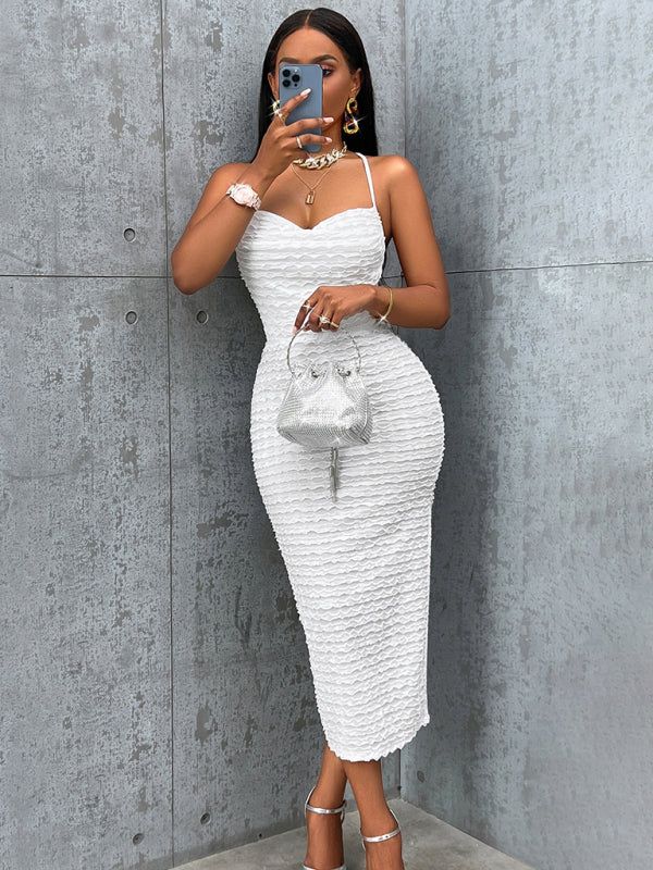 a woman is taking a selfie with her cell phone while wearing a white dress