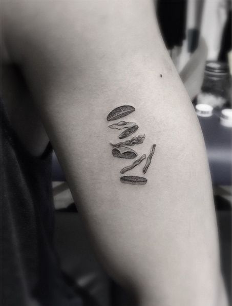 a black and white photo of a person's leg with the word love on it