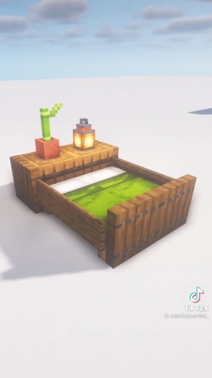 a low poly model of a bed in the middle of an empty field with two candles on it