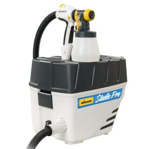 a white and black machine with a hose attached to it's head, on a white background