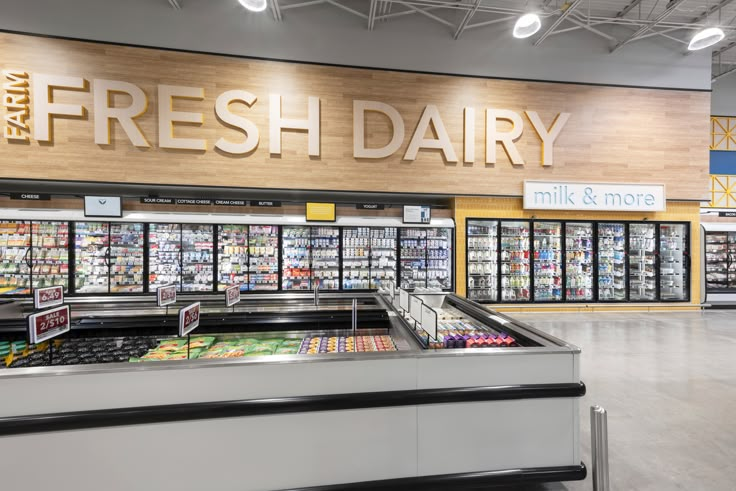 an empty grocery store filled with fresh dairy