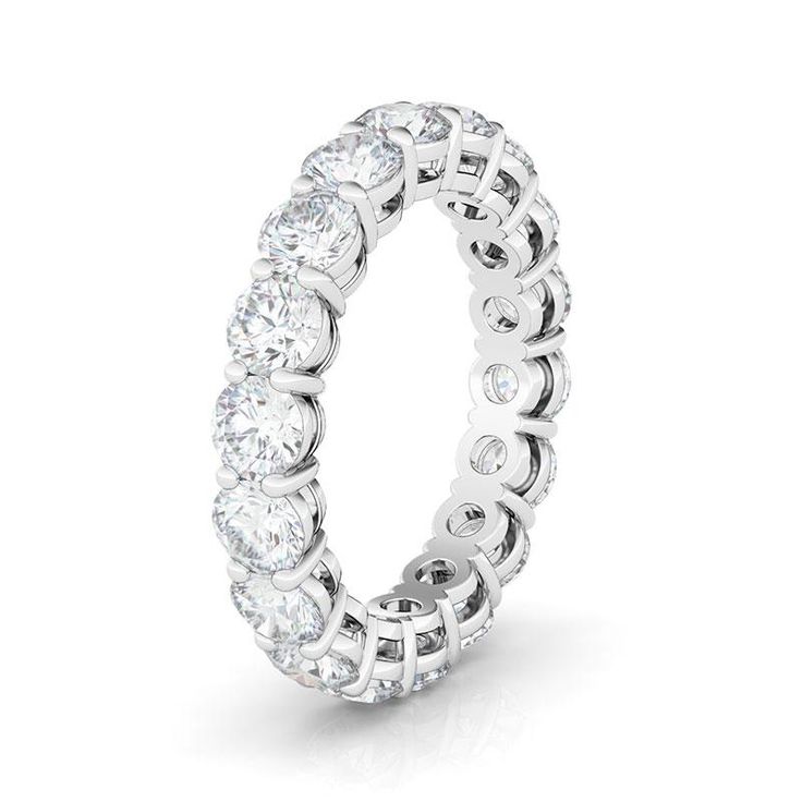 Rockstar radiance, round and round. This HauteCarat diamond eternity band beams a luminous ring of light from round-cut lab diamonds. Luminous Ring, Round Eternity Band, Round Diamond Eternity Band, Stackable Wedding Bands, Sterling Silver Wedding Band, Eternity Rings, Diamond Eternity Band, Silver Wedding Bands, Moissanite Wedding Rings