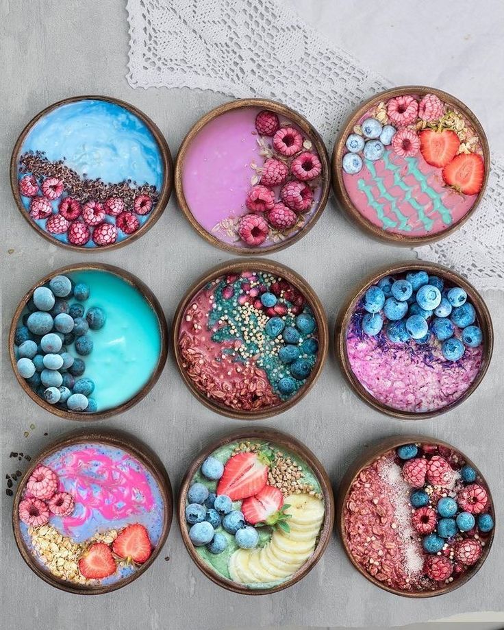 six bowls filled with different types of desserts on top of a white doily