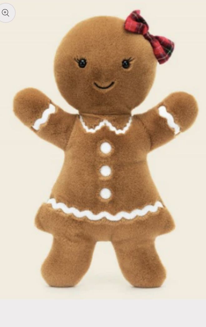 a stuffed ginger with a red bow on its head and hands in the shape of a girl