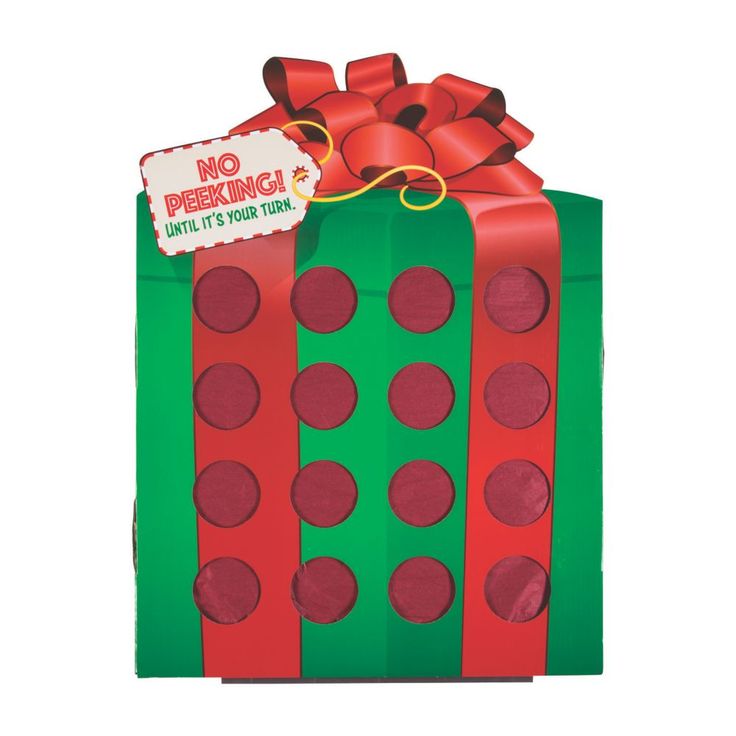 a green and red gift box with polka dots