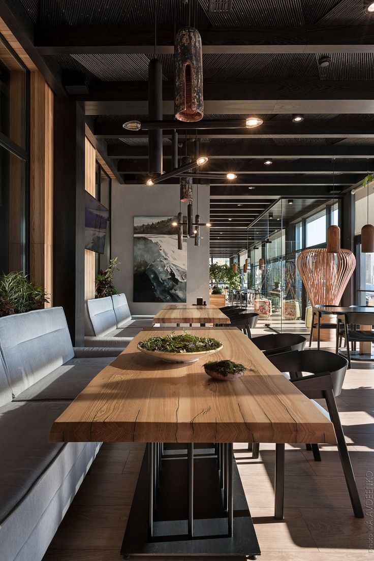 a large wooden table sitting in the middle of a room