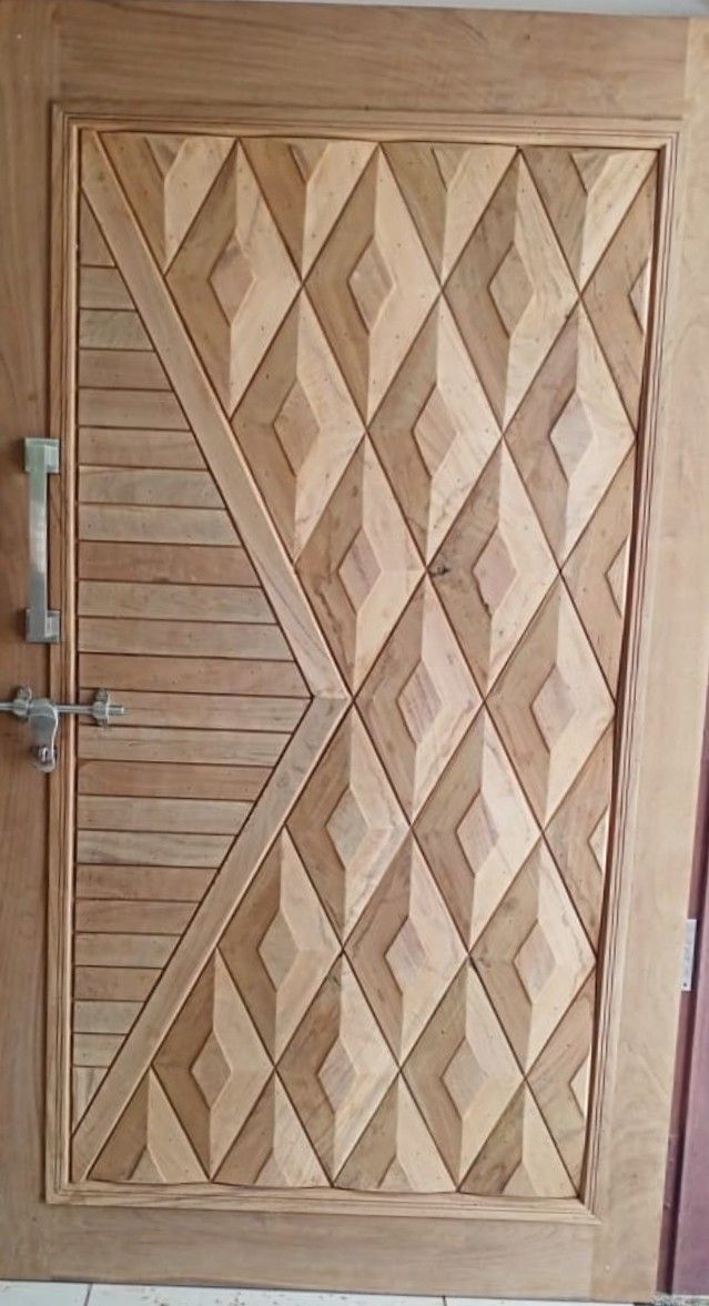 a wooden door with an intricate design on it