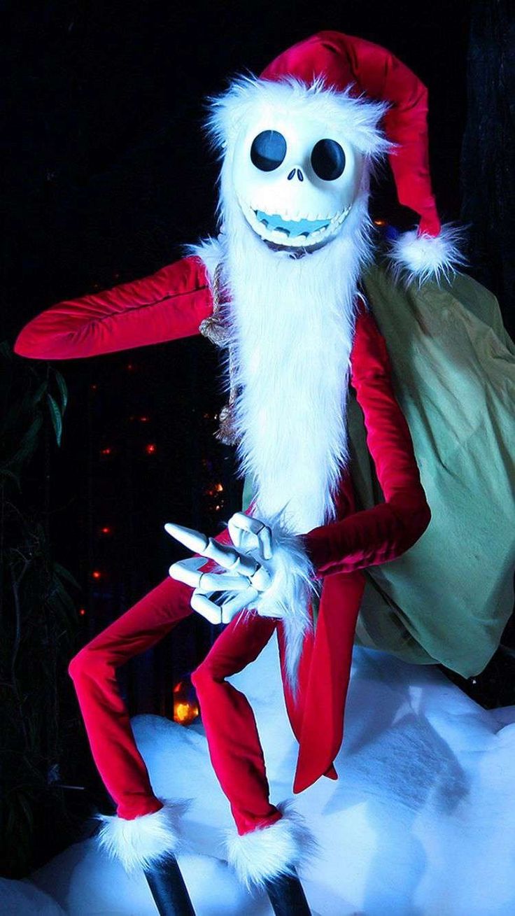 a person dressed as santa claus in the snow