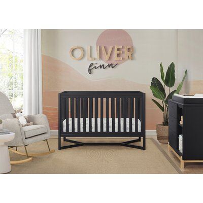 a baby's room with a crib, rocking chair and other furniture in it