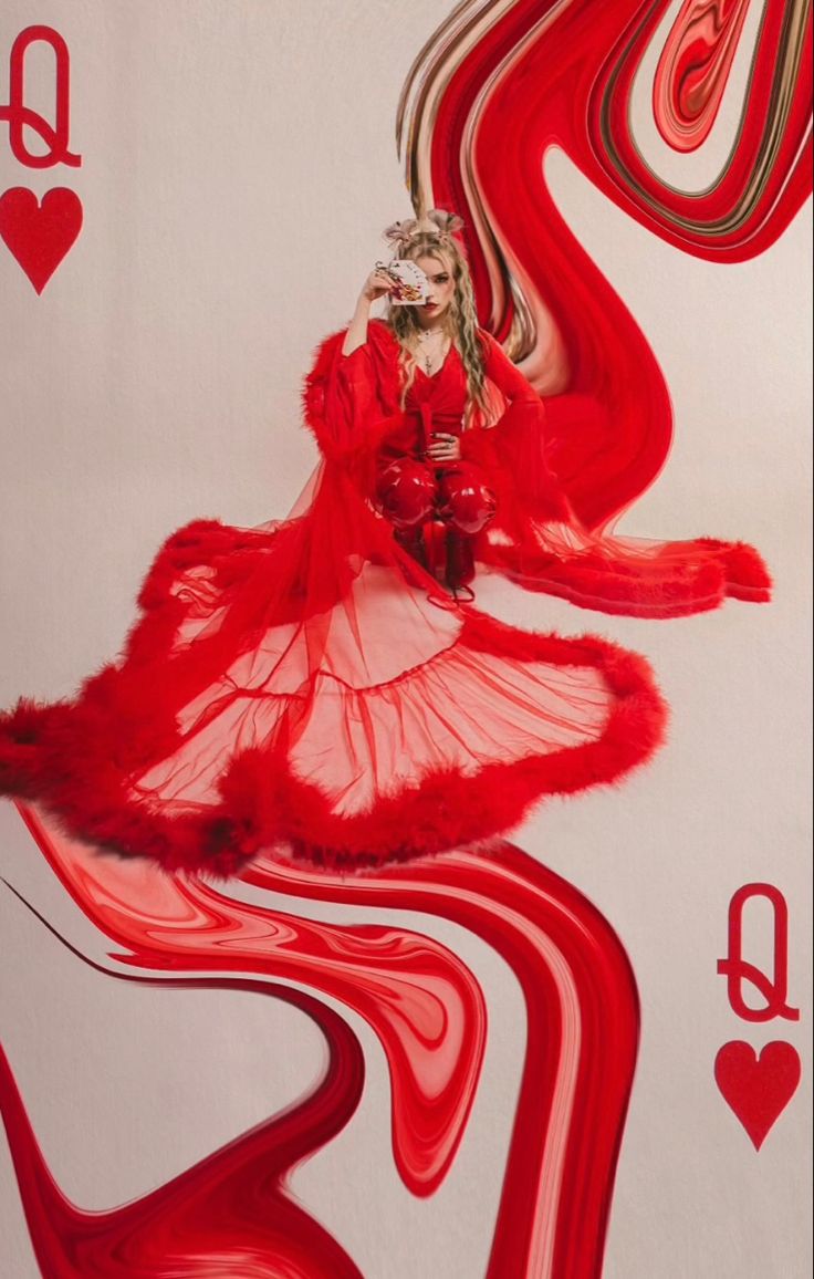 a woman in a red dress is holding a card with hearts and playing cards on it