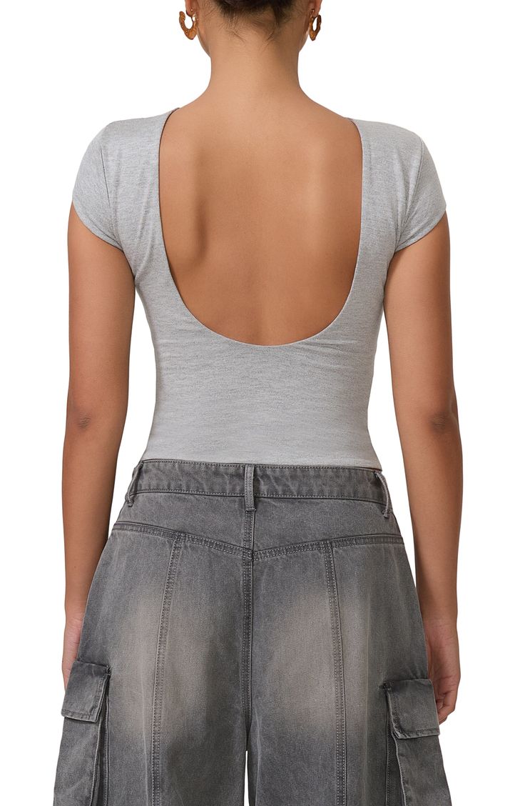 A cropped top presents as simple and standard from the front but serves seriously sultry vibes in the back. 18 1/2" length (size Medium) Boat neck lined Short sleeves Open back 95% rayon, 5% spandex Machine wash, tumble dry Imported Summer Low-cut Crop Top With Built-in Bra, Fitted Low-cut Top With Built-in Bra, Spring Scoop Neck Crop Top With Built-in Bra, Scoop Neck Crop Top With Built-in Bra For Spring, Chic Scoop Neck Crop Top With Built-in Bra, Fitted Crop Top With Built-in Bra And Scoop Back, Chic Seamless Low-cut Crop Top, Fitted Trendy Crop Top, Bra Friendly Backless Crop Top For Night Out